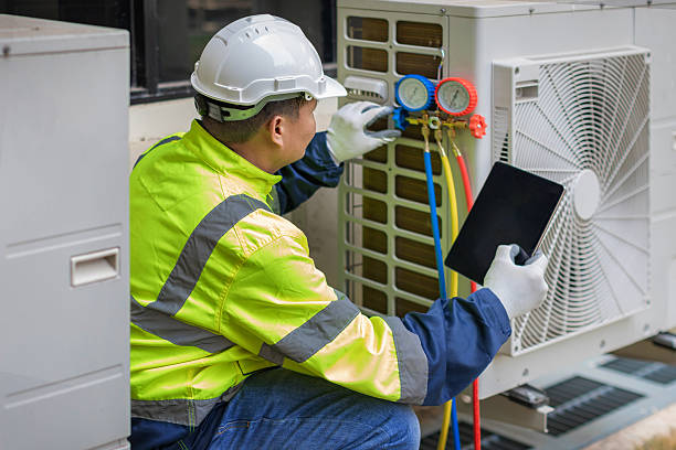 Professional Hvac technician working in Stow, MA